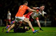 1 February 2025; Brian Kennedy of Tyrone is tackled by Armagh players, from left, Greg McCabe, goalkeeper Ethan Rafferty and Aidan Forker during the Allianz Football League Division 1 match between Armagh and Tyrone at BOX-IT Athletic Grounds in Armagh. Photo by Ben McShane/Sportsfile