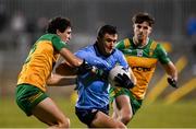 1 February 2025; Colm Basquel of Dublin in action against Finnbarr Roarty of Donegal during the Allianz Football League Division 1 match between Donegal and Dublin at MacCumhaill Park in Ballybofey, Donegal. Photo by Stephen McCarthy/Sportsfile