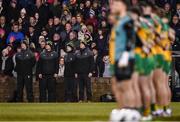 1 February 2025; Donegal manager Jim McGuinness, left, with, from left, Neil McGee, Luke Barrett and Colm McFadden during the playing of the National Anthem before the Allianz Football League Division 1 match between Donegal and Dublin at MacCumhaill Park in Ballybofey, Donegal. Photo by Stephen McCarthy/Sportsfile