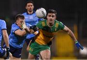 1 February 2025; Caolan McGonagle of Donegal is tackled by Seán Bugler of Dublin during the Allianz Football League Division 1 match between Donegal and Dublin at MacCumhaill Park in Ballybofey, Donegal. Photo by Stephen McCarthy/Sportsfile