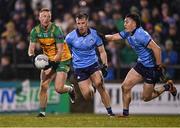 1 February 2025; Oisín Gallen of Donegal in action against Seán Bugler and Killian McGinnis, right, of Dublin during the Allianz Football League Division 1 match between Donegal and Dublin at MacCumhaill Park in Ballybofey, Donegal. Photo by Stephen McCarthy/Sportsfile