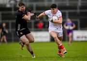 2 February 2025; Sean McDonnell of Cork in action against Peter Fegan of Down during the Allianz Football League Division 2 match between Down and Cork at Páirc Esler in Newry, Down. Photo by Ramsey Cardy/Sportsfile