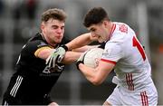 2 February 2025; Sean McDonnell of Cork in action against Ryan Magill of Down during the Allianz Football League Division 2 match between Down and Cork at Páirc Esler in Newry, Down. Photo by Ramsey Cardy/Sportsfile