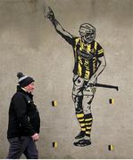 2 February 2025; Kilkenny supporter John Lanigan walks past a painting of Kilkenny hurler TJ Reid before the Allianz Hurling League Division 1A match between Kilkenny and Galway at UPMC Nowlan Park in Kilkenny. Photo by David Fitzgerald/Sportsfile