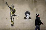 2 February 2025; Kilkenny supporter John Lanigan walks past a painting of Kilkenny hurler TJ Reid before the Allianz Hurling League Division 1A match between Kilkenny and Galway at UPMC Nowlan Park in Kilkenny. Photo by David Fitzgerald/Sportsfile