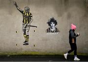 2 February 2025; A supporter walks past a painting of Kilkenny hurlers TJ Reid and Liam 'Chunky' O'Brien before the Allianz Hurling League Division 1A match between Kilkenny and Galway at UPMC Nowlan Park in Kilkenny. Photo by David Fitzgerald/Sportsfile