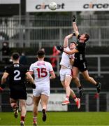 2 February 2025; Caolan Mooney of Down and Rory Maguire of Cork during the Allianz Football League Division 2 match between Down and Cork at Páirc Esler in Newry, Down. Photo by Ramsey Cardy/Sportsfile