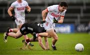 2 February 2025; Chris Og Jones of Cork in action against Peter Fegan of Down during the Allianz Football League Division 2 match between Down and Cork at Páirc Esler in Newry, Down. Photo by Ramsey Cardy/Sportsfile