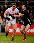 2 February 2025; Colm O'Callaghan of Cork in action against James Guinness of Down during the Allianz Football League Division 2 match between Down and Cork at Páirc Esler in Newry, Down. Photo by Ramsey Cardy/Sportsfile