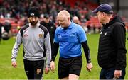 2 February 2025; Referee Barry Cassidy speaks to Down manager Conor Laverty, left, and Cork manager John Cleary, as they leave the pitch at half-time during the Allianz Football League Division 2 match between Down and Cork at Páirc Esler in Newry, Down. Photo by Ramsey Cardy/Sportsfile