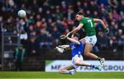 2 February 2025; Ciarán Caulfield of Meath kicks despite the efforts of Luke Molloy of Cavan during the Allianz Football League Division 2 match between Meath and Cavan at Páirc Tailteann in Navan, Meath. Photo by Tyler Miller/Sportsfile