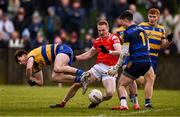 2 February 2025; Donal McKenny of Louth in action against Roscommon players, from left, Brian Stack goalkeeper Conor Carroll and Colm Neary during the Allianz Football League Division 2 match between Louth and Roscommon at Integral GAA Grounds in Drogheda, Louth. Photo by Ben McShane/Sportsfile
