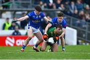 2 February 2025; Seán Coffey of Meath is tackled by Cian Reilly, left, and Dara McVeety of Cavan during the Allianz Football League Division 2 match between Meath and Cavan at Páirc Tailteann in Navan, Meath. Photo by Tyler Miller/Sportsfile