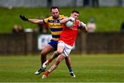 2 February 2025; Conall McKeever of Louth is tackled by Donie Smith of Roscommon during the Allianz Football League Division 2 match between Louth and Roscommon at Integral GAA Grounds in Drogheda, Louth. Photo by Ben McShane/Sportsfile
