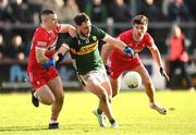 2 February 2025; Paudie Clifford of Kerry in action against Niall Toner, left, and Conor Doherty of Derry during the Allianz Football League Division 1 match between Derry and Kerry at Celtic Park in Derry. Photo by Stephen McCarthy/Sportsfile