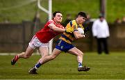 2 February 2025; Niall Higgins of Roscommon is tackled by Sean Reynolds of Louth during the Allianz Football League Division 2 match between Louth and Roscommon at Integral GAA Grounds in Drogheda, Louth. Photo by Ben McShane/Sportsfile