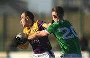 2 February 2025; Seán Ryan of Wexford is tackled by Tony McCarthy of Limerick during the Allianz Football League Division 4 match between Limerick and Wexford at Mick Neville Park in Rathkeale, Limerick. Photo by Tom Beary/Sportsfile