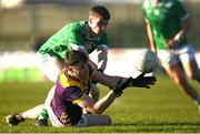 2 February 2025; Niall Hughes of Wexford is tackled by Diarmuid Buckley of Limerick during the Allianz Football League Division 4 match between Limerick and Wexford at Mick Neville Park in Rathkeale, Limerick. Photo by Tom Beary/Sportsfile