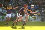 2 February 2025; Craig Morgan of Tipperary in action against Conor Hearne of Wexford during the Allianz Hurling League Division 1A match between Tipperary and Wexford at FBD Semple Stadium in Thurles, Tipperary. Photo by Brendan Moran/Sportsfile