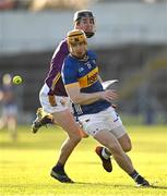 2 February 2025; Jake Morris of Tipperary in action against Eoin Ryan of Wexford during the Allianz Hurling League Division 1A match between Tipperary and Wexford at FBD Semple Stadium in Thurles, Tipperary. Photo by Brendan Moran/Sportsfile