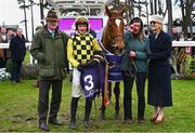 2 February 2025; State Man, centre, jockey Paul Townend, trainer Willie Mullins, groom Rachel Robins and winning connections celebrate after they won The Irish Champion Hurdle during day two of the Dublin Racing Festival at Leopardstown Racecourse in Dublin. Photo by Shauna Clinton/Sportsfile