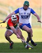2 February 2025; Chris Nolan of Carlow in action against Mairtín Power of Waterford during the Allianz Hurling League Division 1B match between Carlow and Waterford at Netwatch Cullen Park in Carlow. Photo by Stephen Marken/Sportsfile