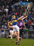 2 February 2025; Jake Morris of Tipperary in action against Charlie McGuckin of Wexford during the Allianz Hurling League Division 1A match between Tipperary and Wexford at FBD Semple Stadium in Thurles, Tipperary. Photo by Brendan Moran/Sportsfile