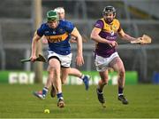 2 February 2025; Brian McGrath of Tipperary in action against Connal Flood of Wexford during the Allianz Hurling League Division 1A match between Tipperary and Wexford at FBD Semple Stadium in Thurles, Tipperary. Photo by Brendan Moran/Sportsfile