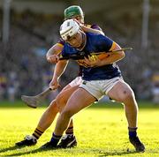 2 February 2025; Darragh McCarthy of Tipperary is tackled by Richie Lawlor of Wexford during the Allianz Hurling League Division 1A match between Tipperary and Wexford at FBD Semple Stadium in Thurles, Tipperary. Photo by Brendan Moran/Sportsfile