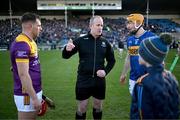 2 February 2025; Referee Johnny Murphy speaks to team captains Conor Hearne of Wexford, left, and Jake Morris of Tipperary in the company of mascot Jake Lenihan before the Allianz Hurling League Division 1A match between Tipperary and Wexford at FBD Semple Stadium in Thurles, Tipperary. Photo by Brendan Moran/Sportsfile