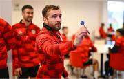 3 February 2025; Derry City's Paul McMullan plays darts as players relax before a team meeting at their new training facility, the Owenbeg Derry GAA Centre, in Dungiven, Derry. Photo by Stephen McCarthy/Sportsfile