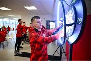 3 February 2025; Derry City's Ciaron Harkin plays darts as players relax before a team meeting at their new training facility, the Owenbeg Derry GAA Centre, in Dungiven, Derry. Photo by Stephen McCarthy/Sportsfile