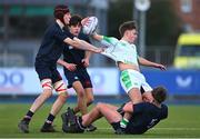 4 February 2025; Paul Batten of Gonzaga College is tackled by Sam Maguire of Wesley College during the Bank of Ireland Leinster Rugby Boys Schools Junior Cup First Round match between Wesley College and Gonzaga College at Energia Park in Dublin. Photo by Shauna Clinton/Sportsfile