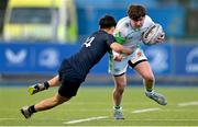 4 February 2025; Oscar Sugrue-Lynch of Gonzaga College in action against Sean Lee of Wesley College during the Bank of Ireland Leinster Rugby Boys Schools Junior Cup First Round match between Wesley College and Gonzaga College at Energia Park in Dublin. Photo by Shauna Clinton/Sportsfile