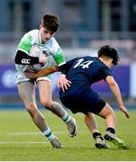 4 February 2025; Cian Benson of Gonzaga College is tackled by Sean Lee of Wesley College during the Bank of Ireland Leinster Rugby Boys Schools Junior Cup First Round match between Wesley College and Gonzaga College at Energia Park in Dublin. Photo by Shauna Clinton/Sportsfile