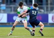 4 February 2025; Cian Benson of Gonzaga College is tackled by Mark Garry of Wesley College during the Bank of Ireland Leinster Rugby Boys Schools Junior Cup First Round match between Wesley College and Gonzaga College at Energia Park in Dublin. Photo by Shauna Clinton/Sportsfile