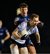 5 February 2025; Senan Forker of UCD in action against Ollie Brooks of TU Dublin during the Electric Ireland Higher Education GAA Sigerson Cup semi-final match between UCD and TU Dublin at the GAA National Games Development Centre in Abbotstown, Dublin. Photo by Tyler Miller/Sportsfile