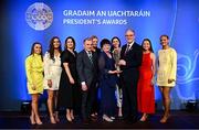 7 February 2025; The McGrath Family of Sarsfield GAA Club, Galway, are presented with the Dermot Early Family Award by Uachtarán Chumann Lúthchleas Gael Jarlath Burns and AIB chief customer officer Orlaith Ryan during the Gradaim an Uachtaráin at Croke Park in Dublin. Photo by Seb Daly/Sportsfile