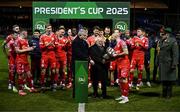 7 February 2025; President of Ireland Michael D Higgins and FAI President Paul Cooke, left, present the FAI President's Cup to Shelbourne captain Mark Coyle after the 2025 Men's FAI President's Cup final match between Shelbourne and Drogheda United at Tolka Park in Dublin. Photo by Stephen McCarthy/Sportsfile