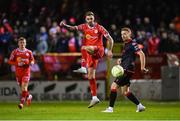 7 February 2025; Ellis Chapman of Shelbourne in action against Paul Doyle of Drogheda United during the 2025 Men's FAI President's Cup final match between Shelbourne and Drogheda United at Tolka Park in Dublin. Photo by Stephen McCarthy/Sportsfile