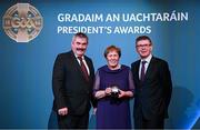 7 February 2025; Leinster award recipient Margaret Byrne of Mount Leinster Rangers GAA, Carlow, with Eddie Byrne and Ard Stiúrthóir of the GAA Tom Ryan during the Gradaim an Uachtaráin at Croke Park in Dublin. Photo by Seb Daly/Sportsfile