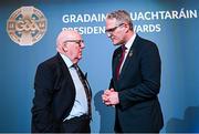 7 February 2025; International award recipient Martin Grogan of Roger Casements GAA Club, Warwickshire, left, and Uachtarán Chumann Lúthchleas Gael Jarlath Burns during the Gradaim an Uachtaráin at Croke Park in Dublin. Photo by Seb Daly/Sportsfile