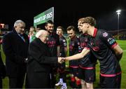 7 February 2025; President of Ireland Michael D Higgins, in the company of FAI President Paul Cooke is introduced to Andrew Quinn by Drogheda United captain Ryan Brennan before the 2025 Men's FAI President's Cup final match between Shelbourne and Drogheda United at Tolka Park in Dublin. Photo by Stephen McCarthy/Sportsfile