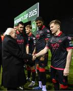 7 February 2025; President of Ireland Michael D Higgins, in the company of FAI President Paul Cooke is introduced to Conor Kane by Drogheda United captain Ryan Brennan before the 2025 Men's FAI President's Cup final match between Shelbourne and Drogheda United at Tolka Park in Dublin. Photo by Stephen McCarthy/Sportsfile