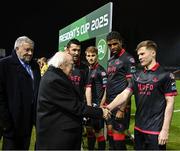 7 February 2025; President of Ireland Michael D Higgins, in the company of FAI President Paul Cooke is introduced to Conor Kane by Drogheda United captain Ryan Brennan before the 2025 Men's FAI President's Cup final match between Shelbourne and Drogheda United at Tolka Park in Dublin. Photo by Stephen McCarthy/Sportsfile