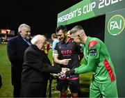 7 February 2025; President of Ireland Michael D Higgins, in the company of FAI President Paul Cooke is introduced to goalkeeper Luke Dennison by Drogheda United captain Ryan Brennan before the 2025 Men's FAI President's Cup final match between Shelbourne and Drogheda United at Tolka Park in Dublin. Photo by Stephen McCarthy/Sportsfile