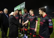 7 February 2025; President of Ireland Michael D Higgins, in the company of FAI President Paul Cooke is introduced to Conor Kane by Drogheda United captain Ryan Brennan before the 2025 Men's FAI President's Cup final match between Shelbourne and Drogheda United at Tolka Park in Dublin. Photo by Stephen McCarthy/Sportsfile