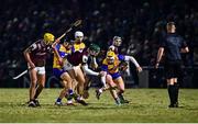 8 February 2025; Fintan Burke of Galway and Seán Rynne of Clare tussle for possession as referee Michael Kennedy watches on during the Allianz Hurling League Division 1A match between Galway and Clare at Pearse Stadium in Galway. Photo by Tyler Miller/Sportsfile