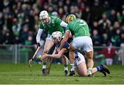 9 February 2025; Darragh McCarthy of Tipperary in action against Limerick players Fergal O’Connor, left, and Dan Morrissey during the Allianz Hurling League Division 1A match between Limerick and Tipperary at TUS Gaelic Grounds in Limerick. Photo by Seb Daly/Sportsfile