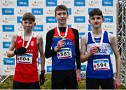 9 February 2025; Boys U15 2500m medalists, from left, silver medalist Gearoid Farrell of Gowran AC, Kilkenny, gold medalist Conor Martin of Derg AC, Clare, and bronze medlaist Mark Alexander of Finn Valley AC, Donegal, during the 123.ie National Intermediate, Masters & Juvenile B Cross Country Championships 2025 at Westport Athletics Centre in Mayo. Photo by Tyler Miller/Sportsfile